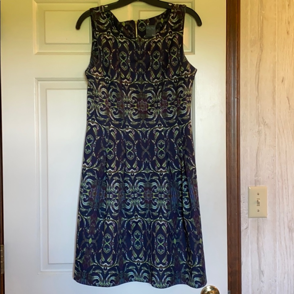 Adorable dress with pockets. 95% poly 5% spandex